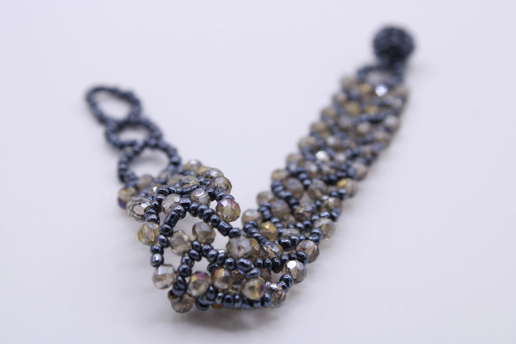 Bracciale Astra – Bracciale con cristalli intrecciati Surya