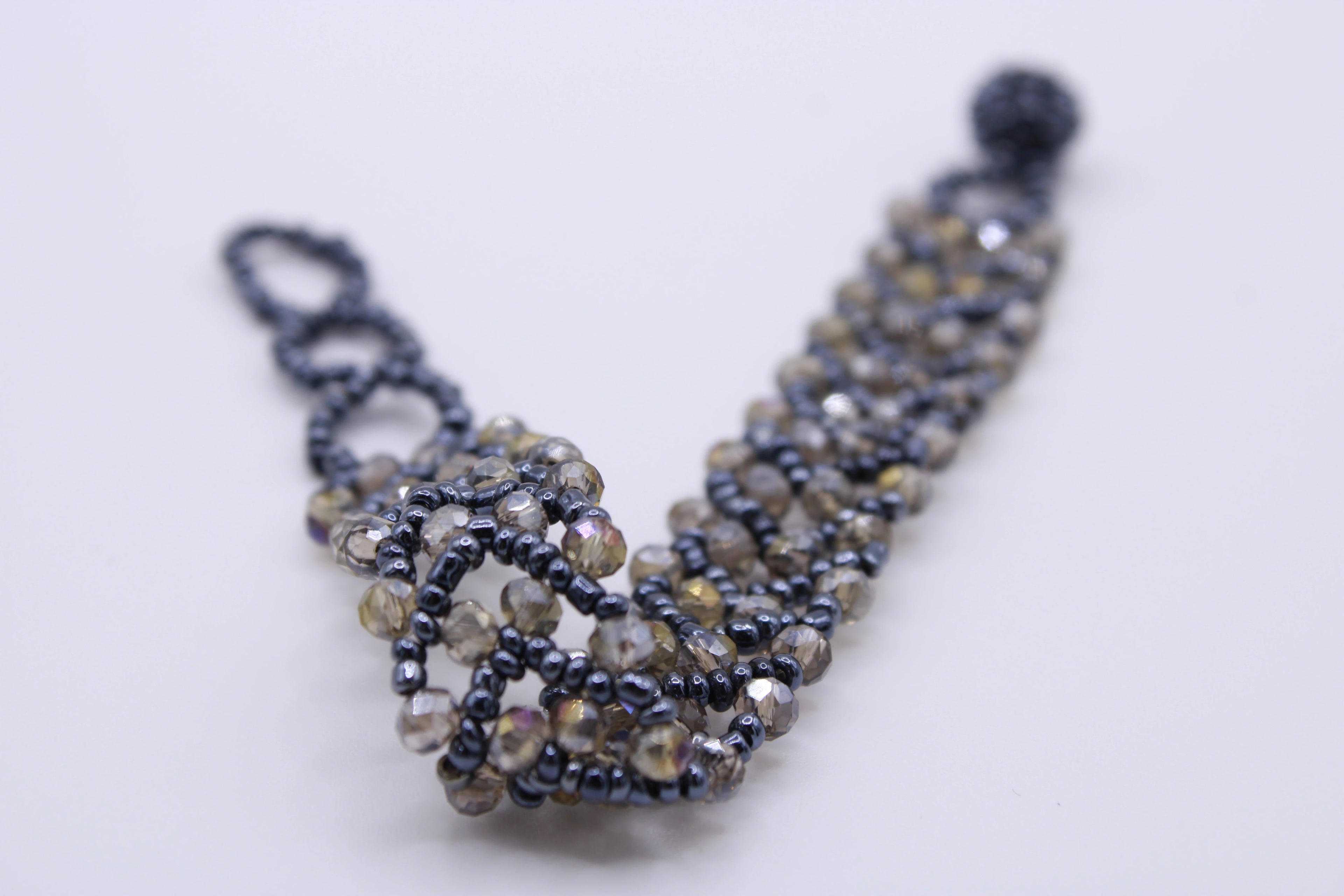 Bracciale Astra – Bracciale con cristalli intrecciati Surya