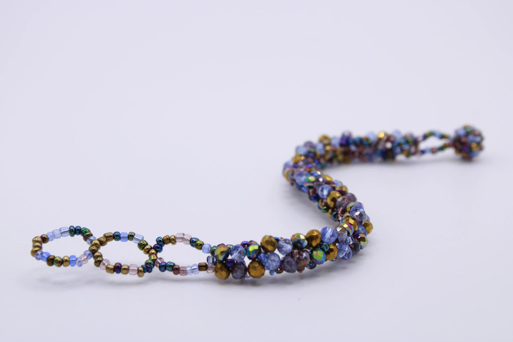 Bracciale Astra – Bracciale con cristalli intrecciati Surya